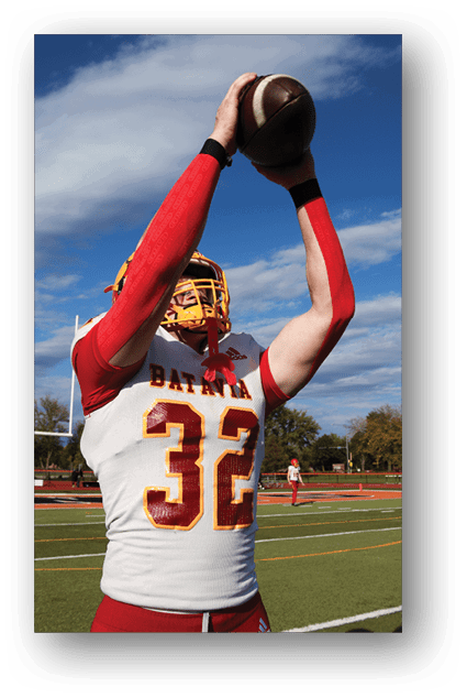 A football player catching a ball. Description generated by AI
