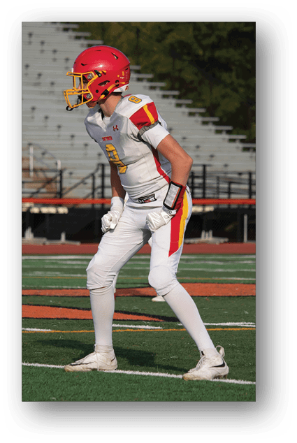 A football player catching a ball. Description generated by AI