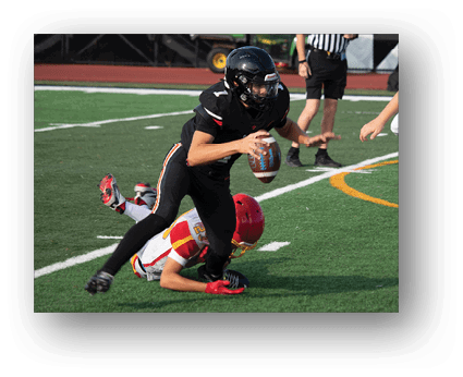 A group of football players on a field. Description generated by AI