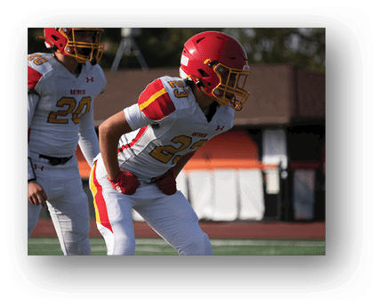 A group of football players on a field. Description generated by AI