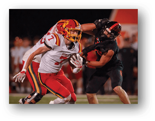 A football player running on the field. Description generated by AI