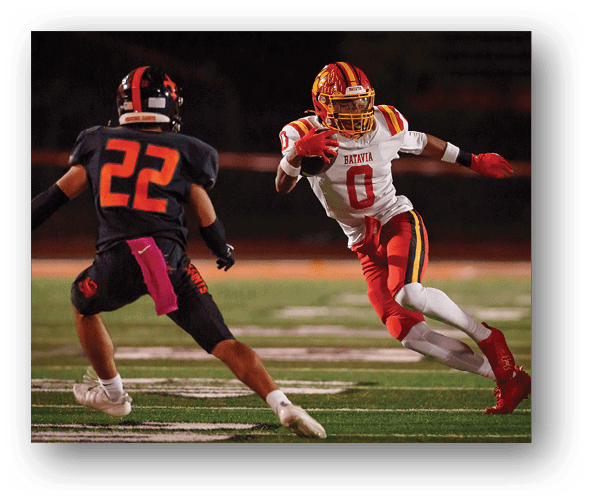 A group of football players celebrating a touchdown. Description generated by AI
