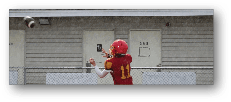A football player wearing a blue and white uniform. Description generated by AI