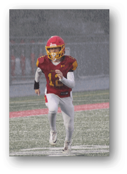 A football game is being played on a field. Description generated by AI