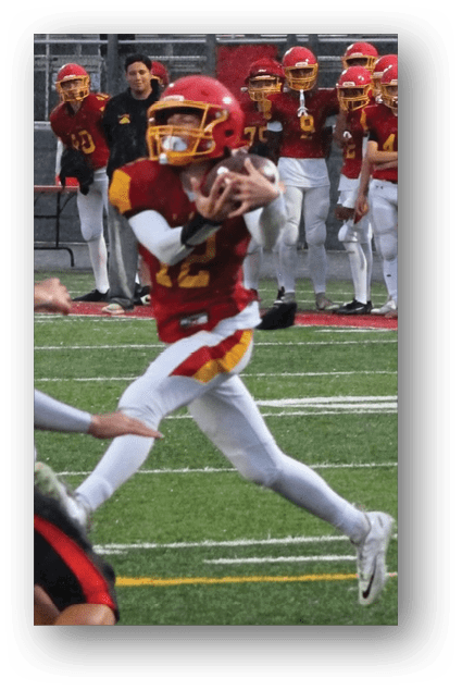 A football player catching a ball. Description generated by AI