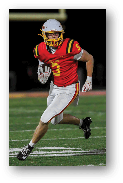 A football player catching a ball. Description generated by AI