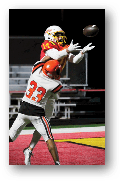 A football player catching a ball. Description generated by AI