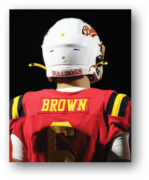 A football player catching a ball. Description generated by AI