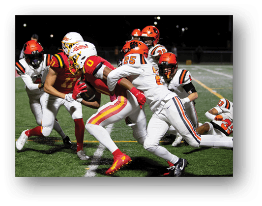 A football player running on the field. Description generated by AI