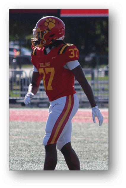 A football player catching a ball. Description generated by AI