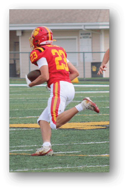 A football player catching a ball. Description generated by AI