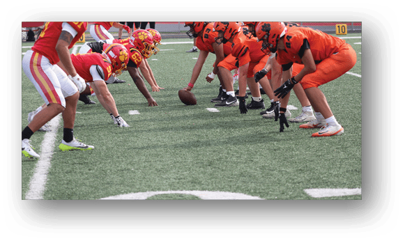 A group of football players on a field. Description generated by AI