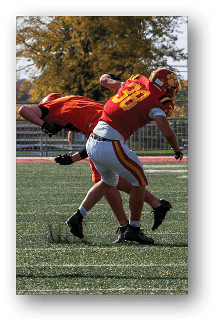 A football player catching a ball. Description generated by AI