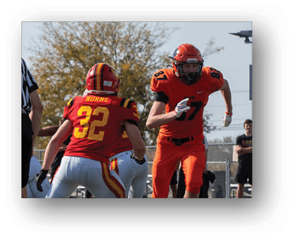 A group of football players on a field. Description generated by AI