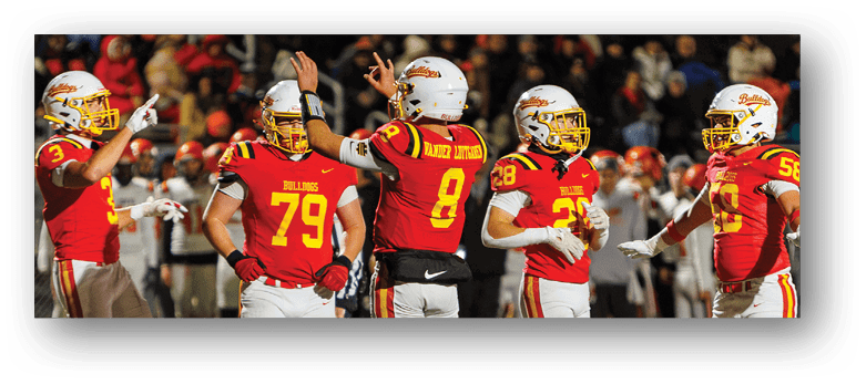 A group of football players on a field. Description generated by AI