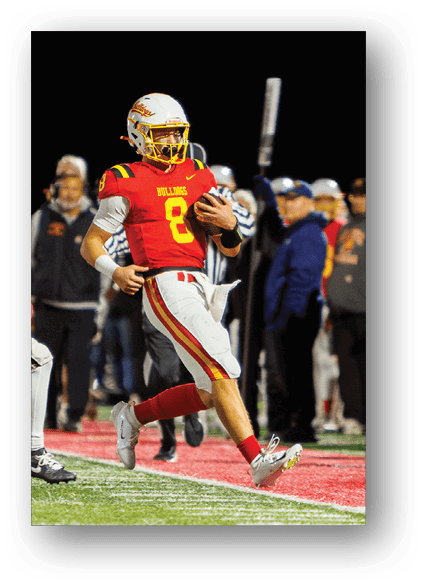 A group of football players celebrating a touchdown. Description generated by AI