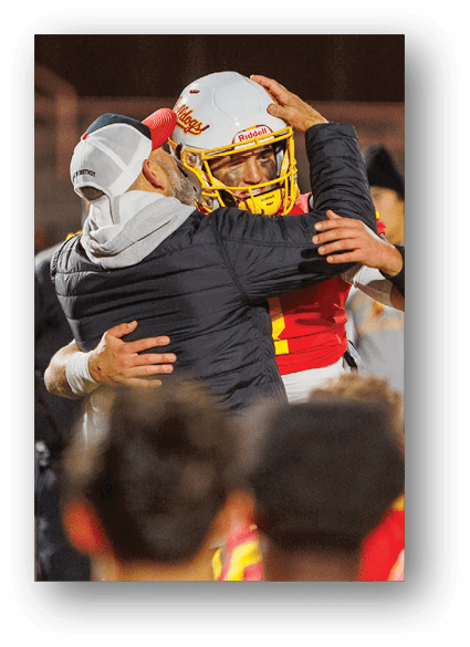 A group of football players celebrating a touchdown. Description generated by AI