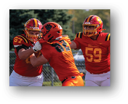 A group of football players on a field. Description generated by AI