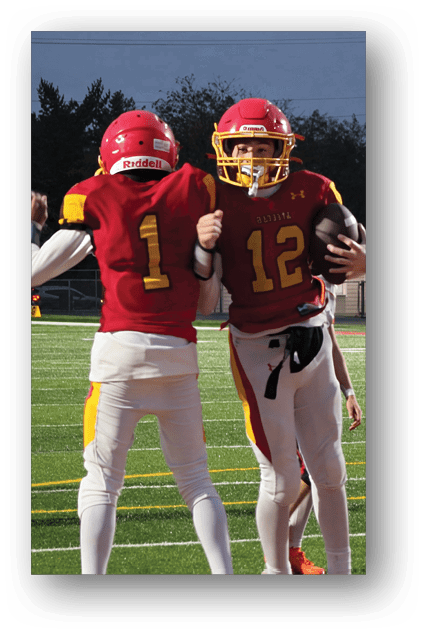 A football player catching a ball. Description generated by AI