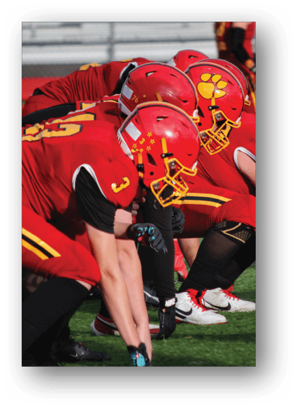 A football game is being played on a field. Description generated by AI