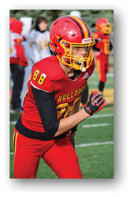 A football player catching a ball. Description generated by AI