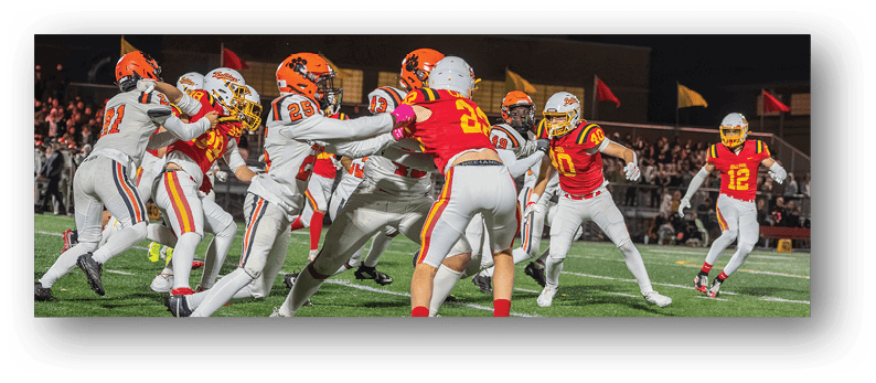 A group of football players on a field. Description generated by AI