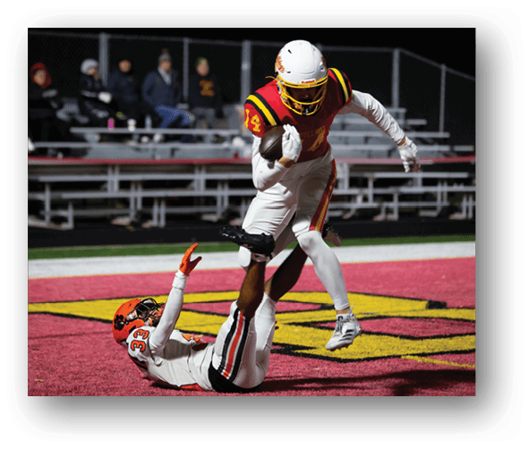 A group of football players celebrating a touchdown. Description generated by AI