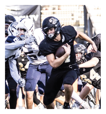 A football player in a black jersey is running with the ball. Description generated by AI