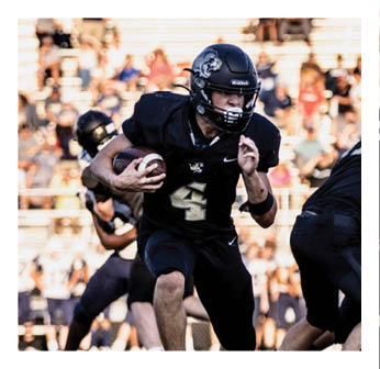A football player with the number 4 on his jersey. Description generated by AI
