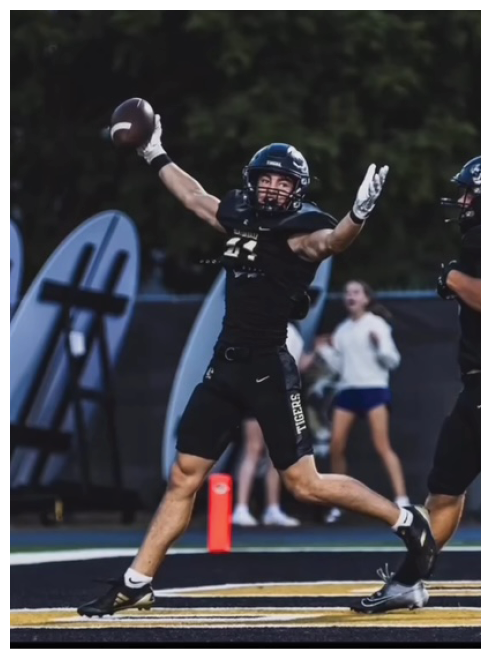A football player catching a ball. Description generated by AI