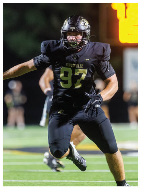 A football player with the number 37 on his jersey. Description generated by AI