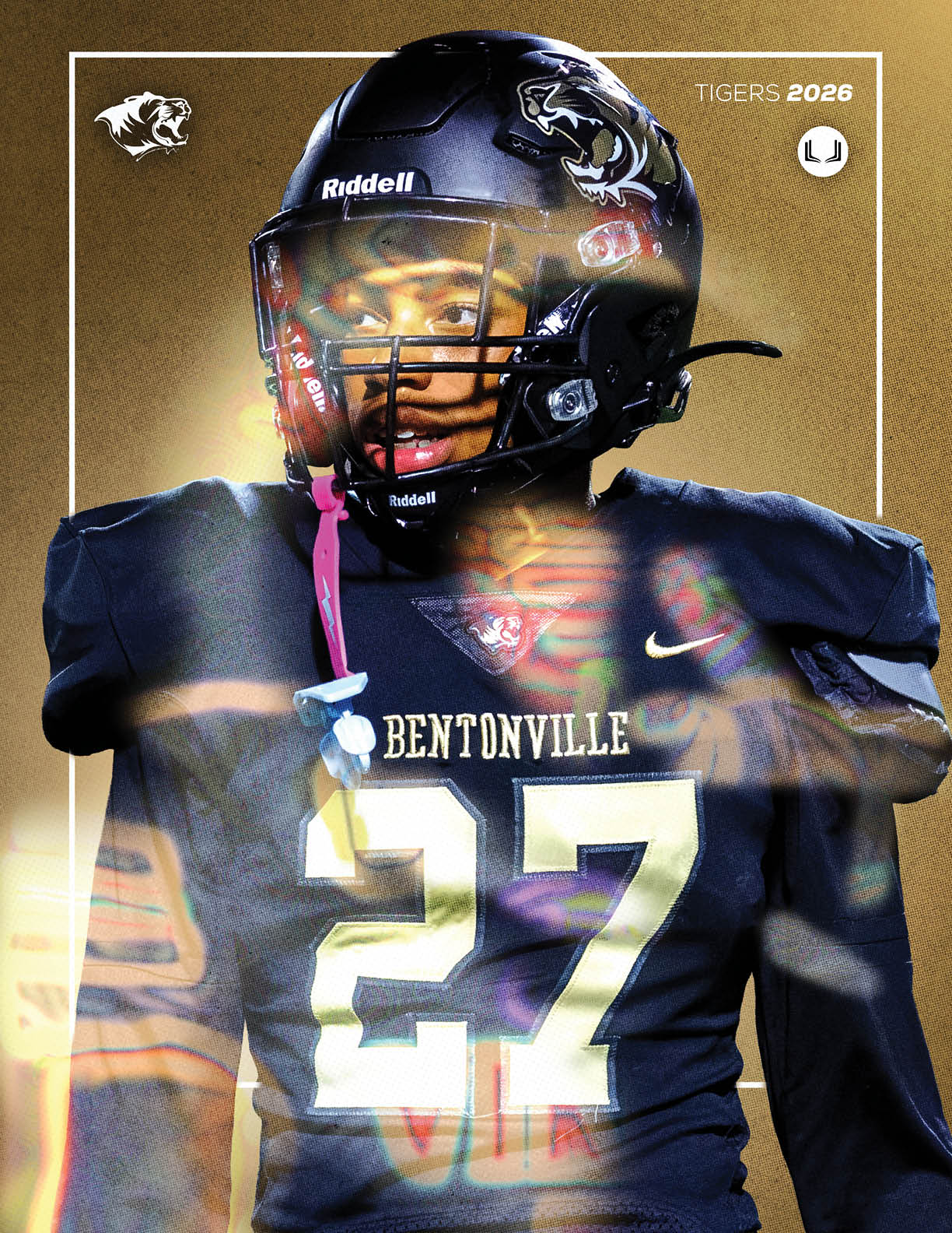 A football player wearing a black and gold jersey with the number 27 on it. Description generated by AI