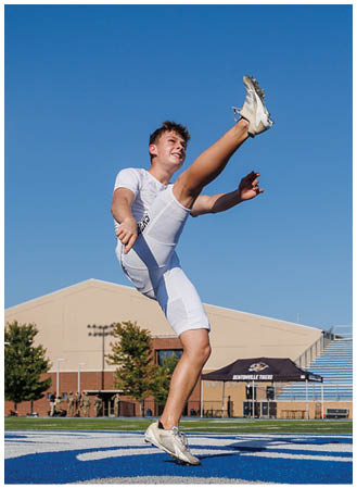 A man is kicking a soccer ball on a field. Description generated by AI