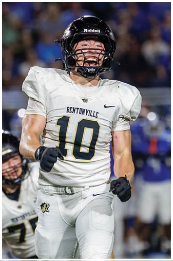 A football player wearing a number 10 jersey. Description generated by AI
