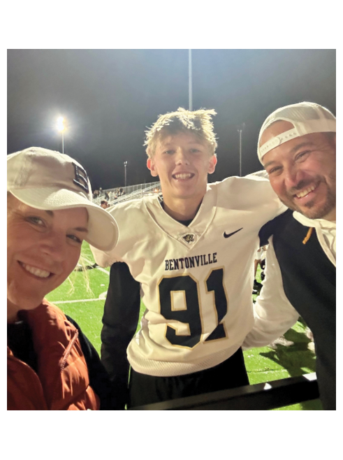 A man wearing a white jersey with the number 91 on it. Description generated by AI