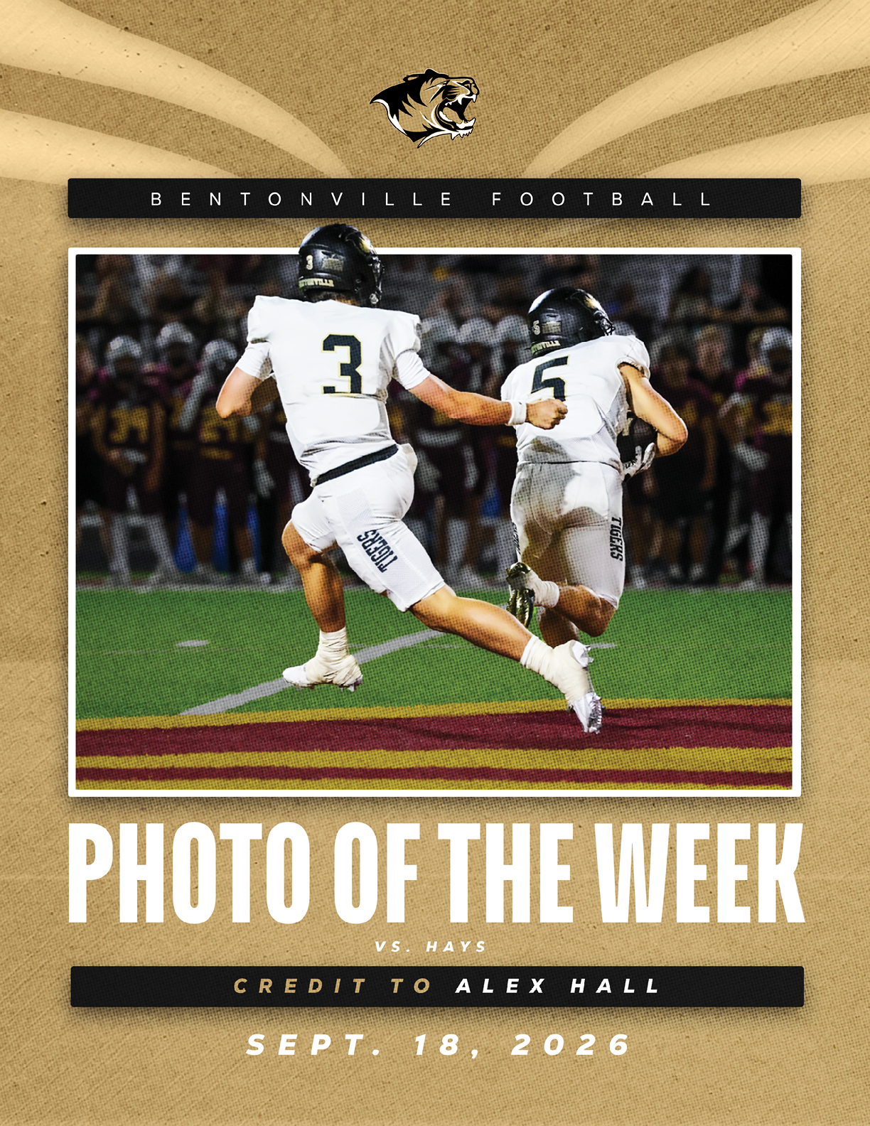 A football player in a white jersey catching a ball. Description generated by AI