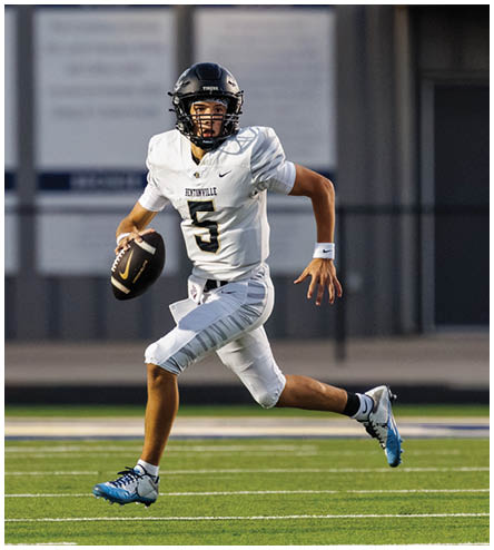 A football player wearing a black helmet and white jersey. Description generated by AI
