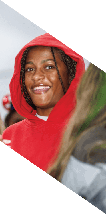 A group of football players wearing headphones and smiling. AI generated content