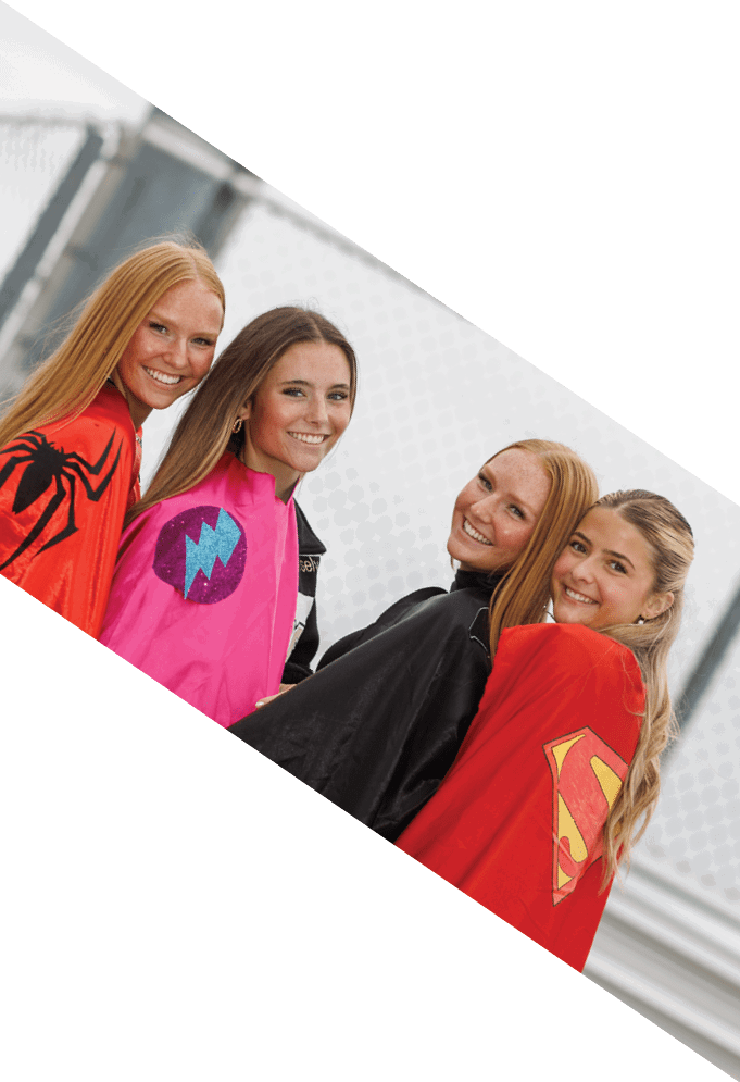Four football players pose for a picture on the field. AI generated content