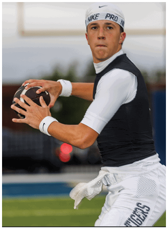 A man is kicking a soccer ball on a field. Description generated by AI