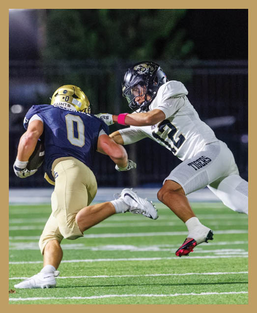 A football player in a white uniform is running with a football in his hand. AI generated content