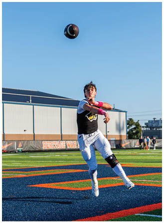 A man is kicking a soccer ball on a field. Description generated by AI