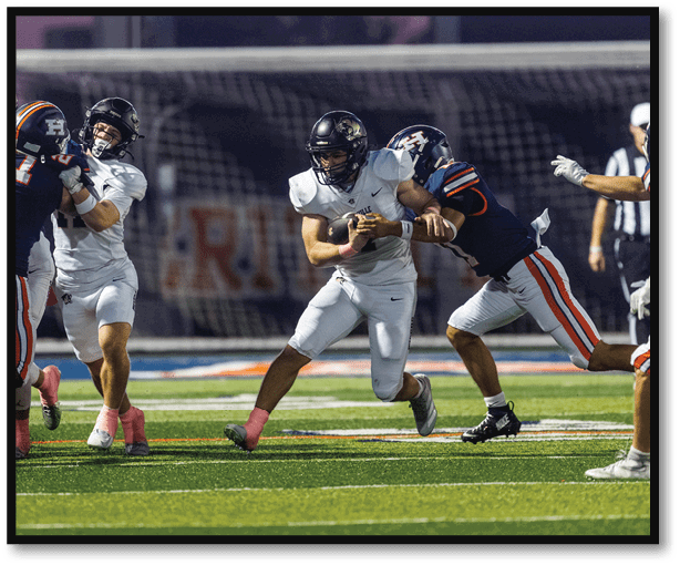 A group of football players wearing black jerseys with the number 3 on them. Description generated by AI