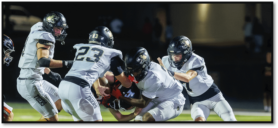 A football player running on the field. Description generated by AI