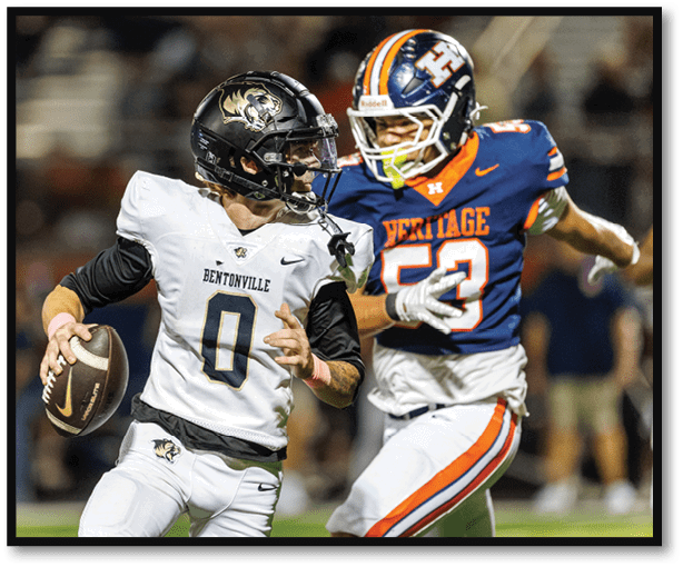 A group of football players wearing black jerseys with the number 3 on them. Description generated by AI