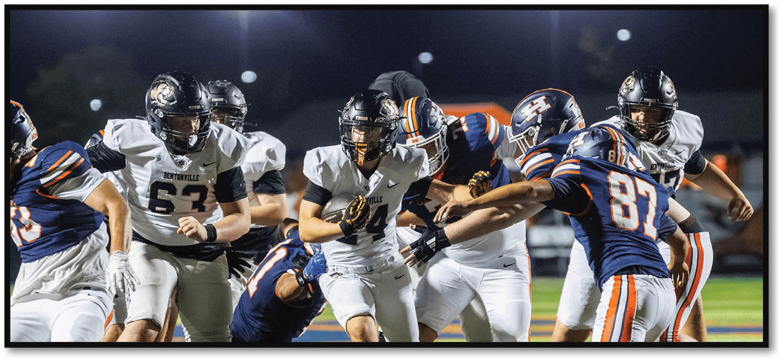 A football player running on the field. Description generated by AI