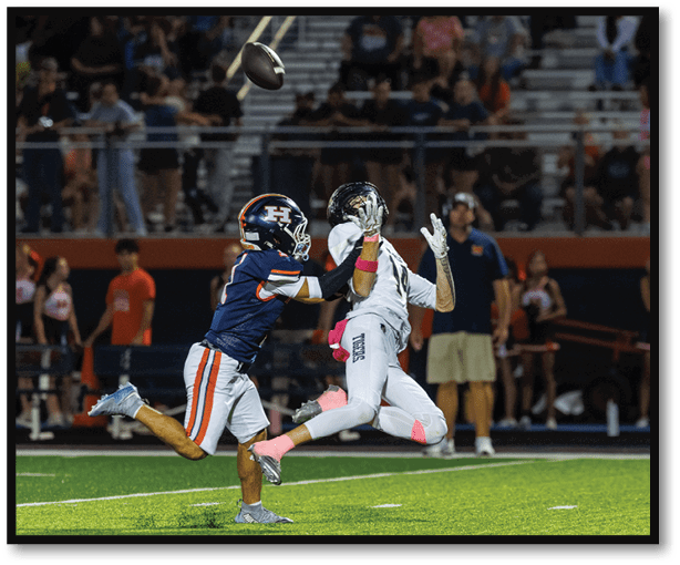 A football player is kicking a football on a field. Description generated by AI