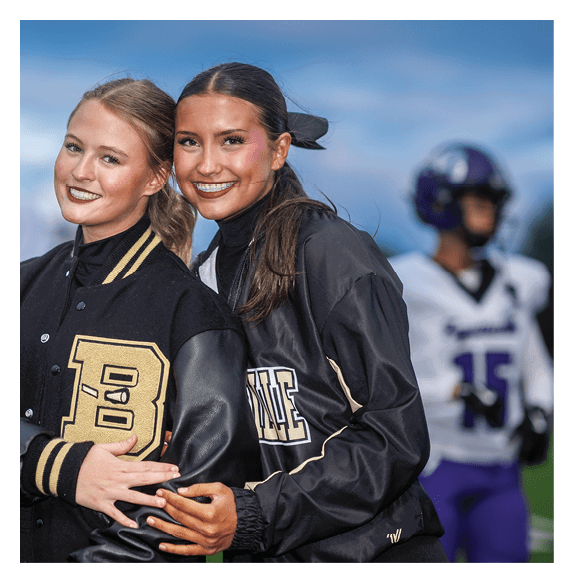 Two football players wearing Vista jerseys and holding hands. AI generated content