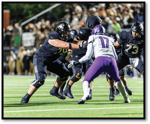 A group of football players wearing black jerseys with the number 3 on them. Description generated by AI