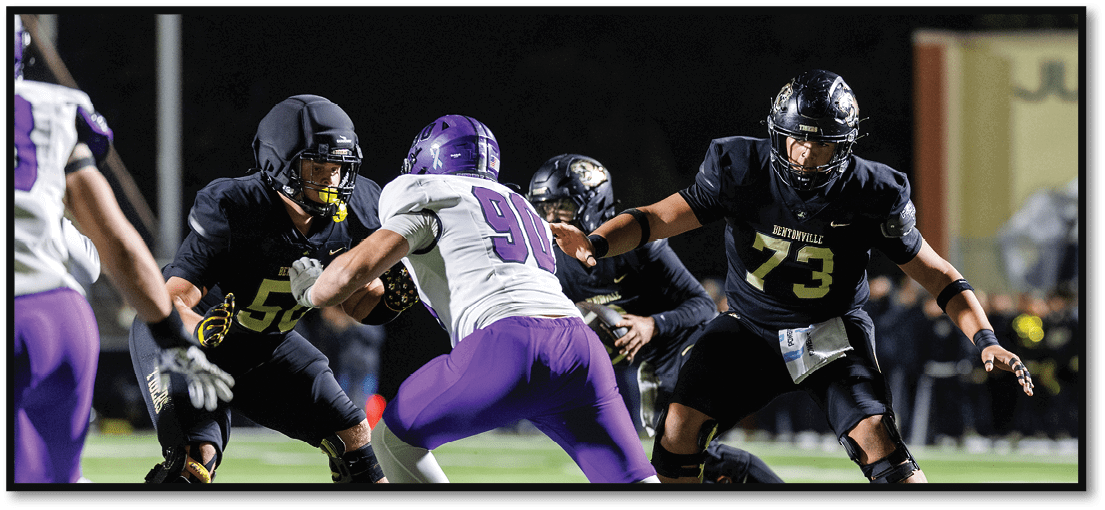 A football player running on the field. Description generated by AI